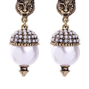 Feline earrings luxury pierced.

.5 inches wide and 1.5 inches long